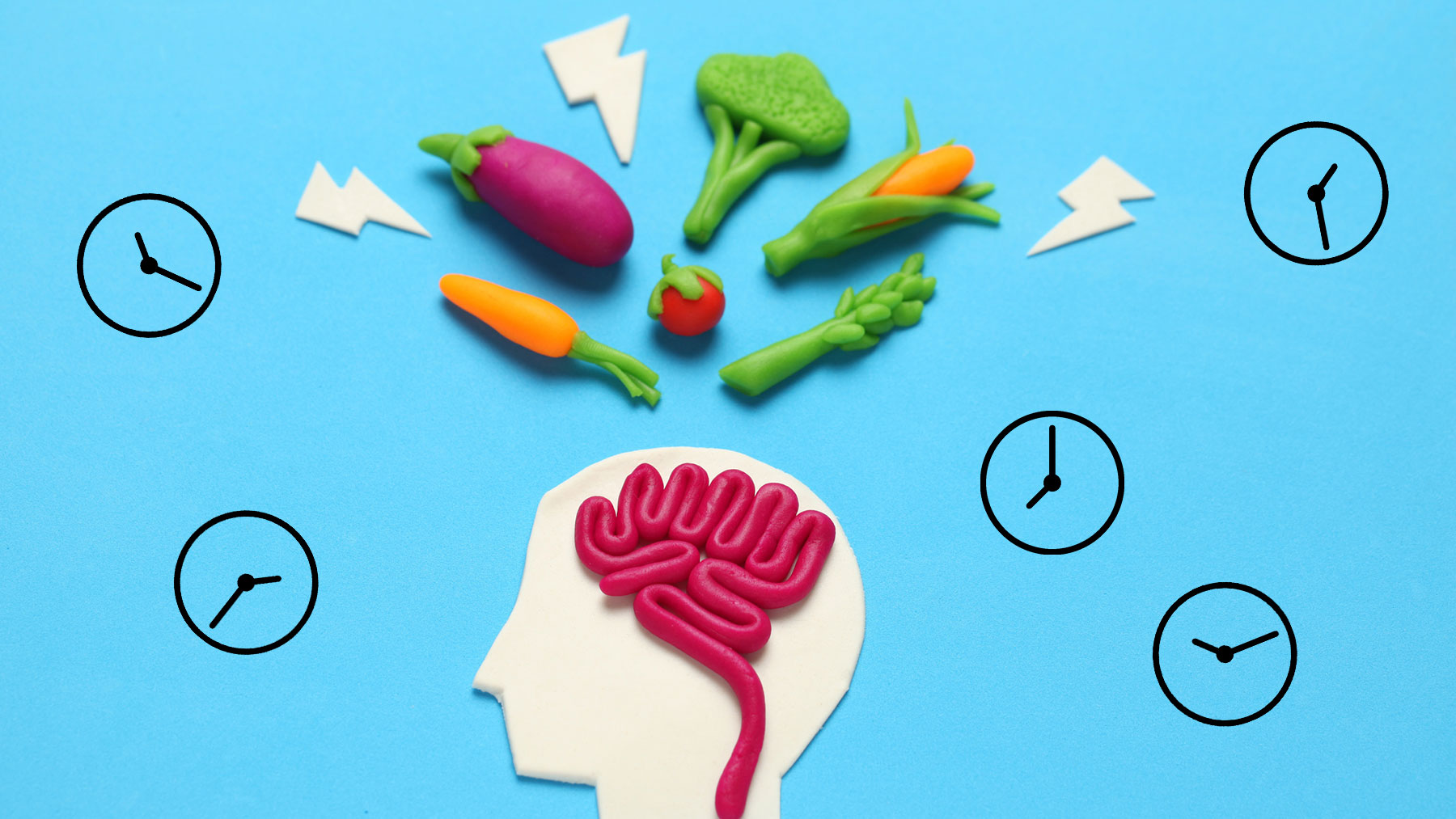 Illustration med hjärna, grönsaker och klockor