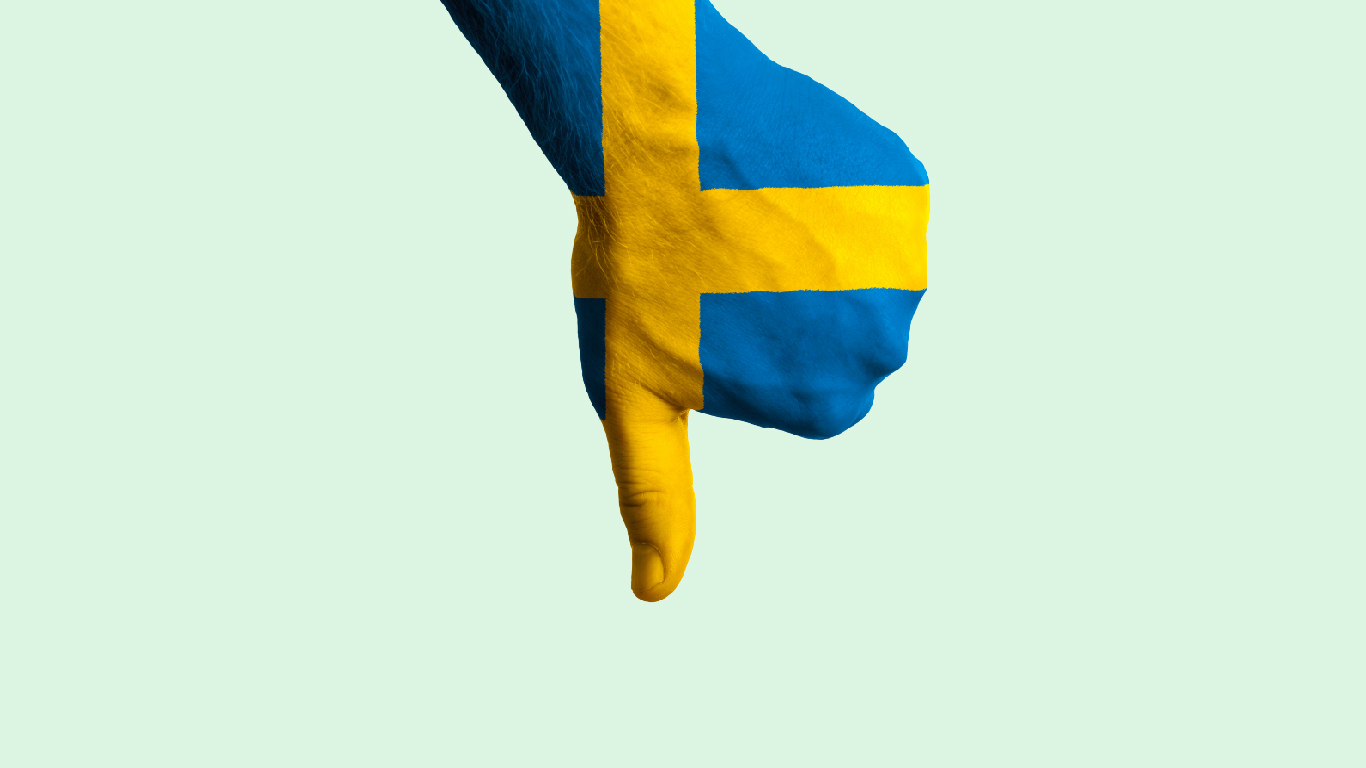 En hand i svenska flaggans färger som visar tummen ner.