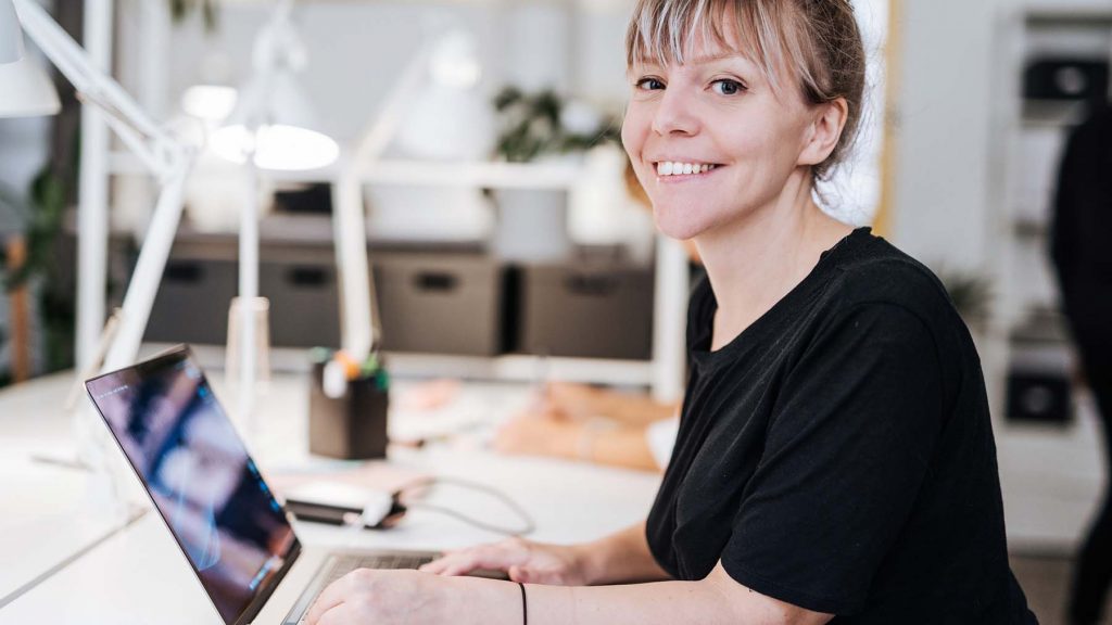 portrait-of-graphic-designer-in-scandinavia-working-on-laptop